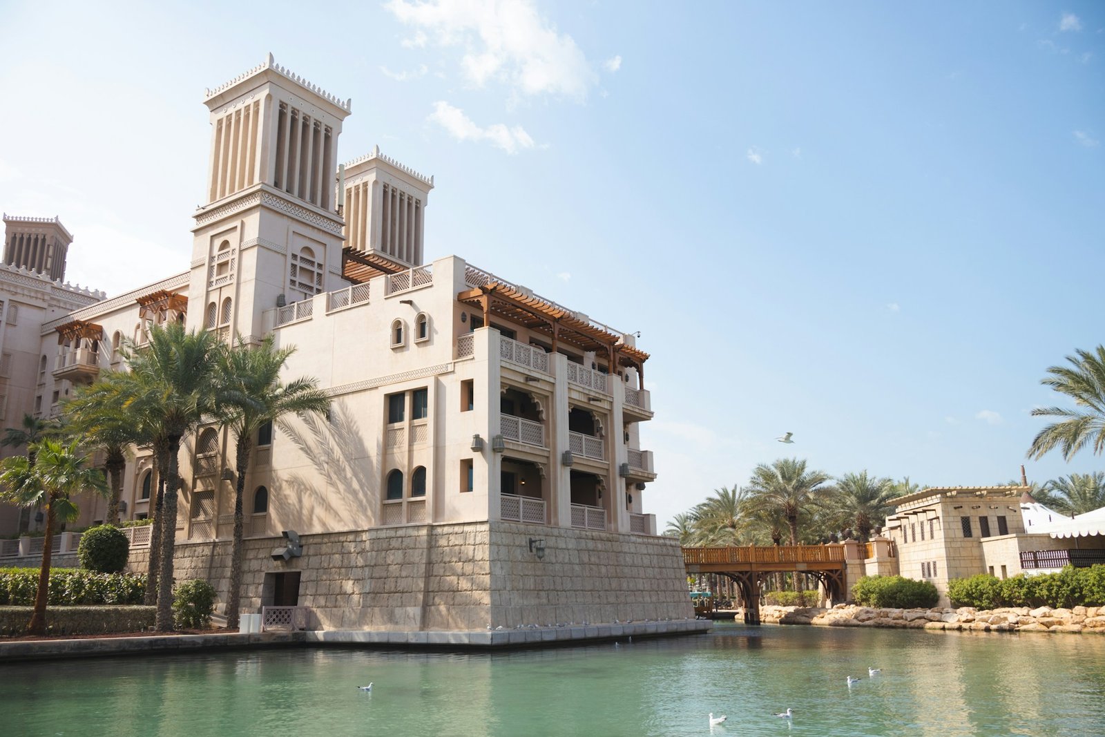 Low-rise Dubai residential architecture on a landscaped waterway, Madinat Jumeirah