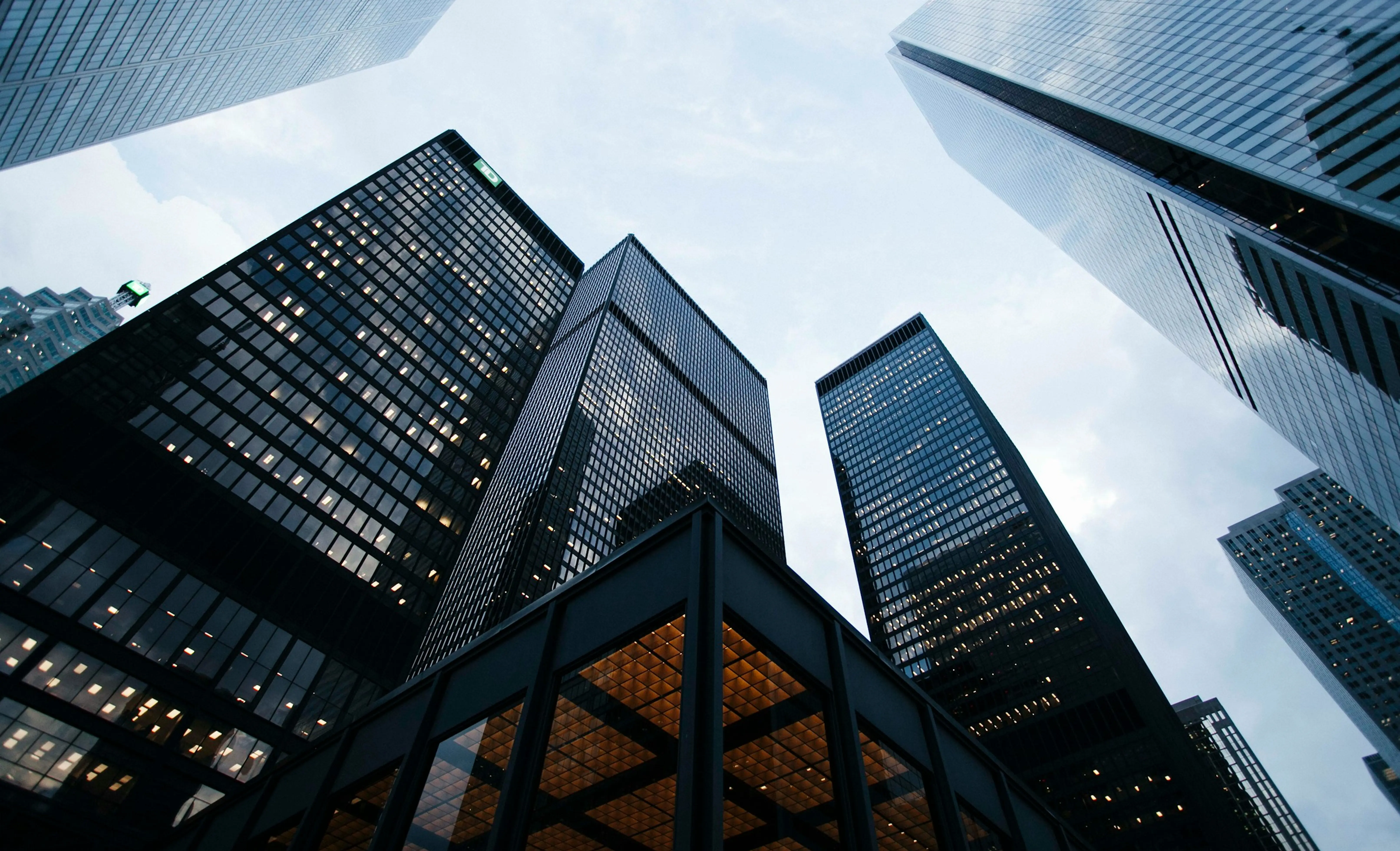 Financial-district towers seen from below — a global-city investment context